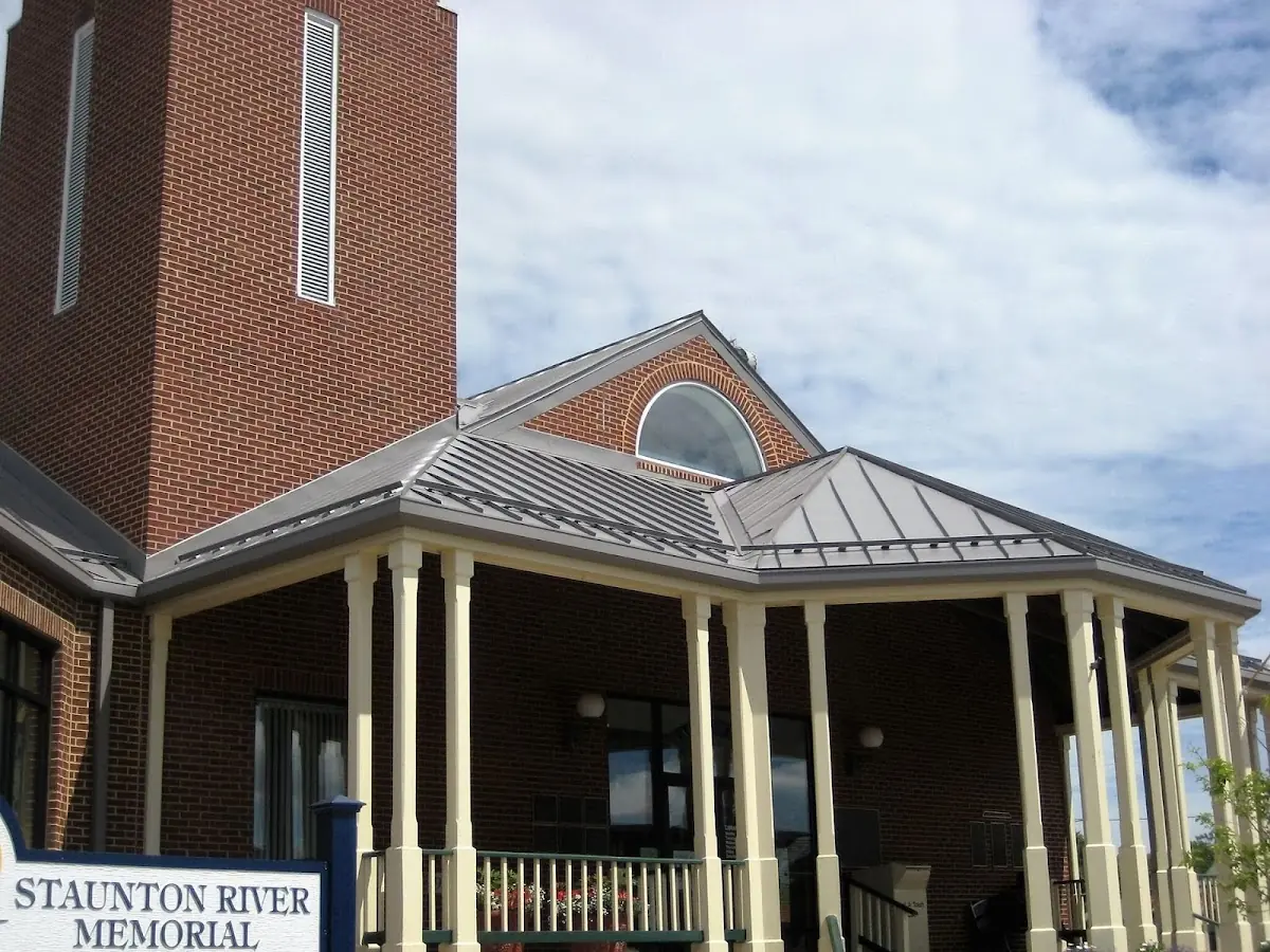 Skilled roofing craftsmen working on a residential roof in Marquette's Crossing West